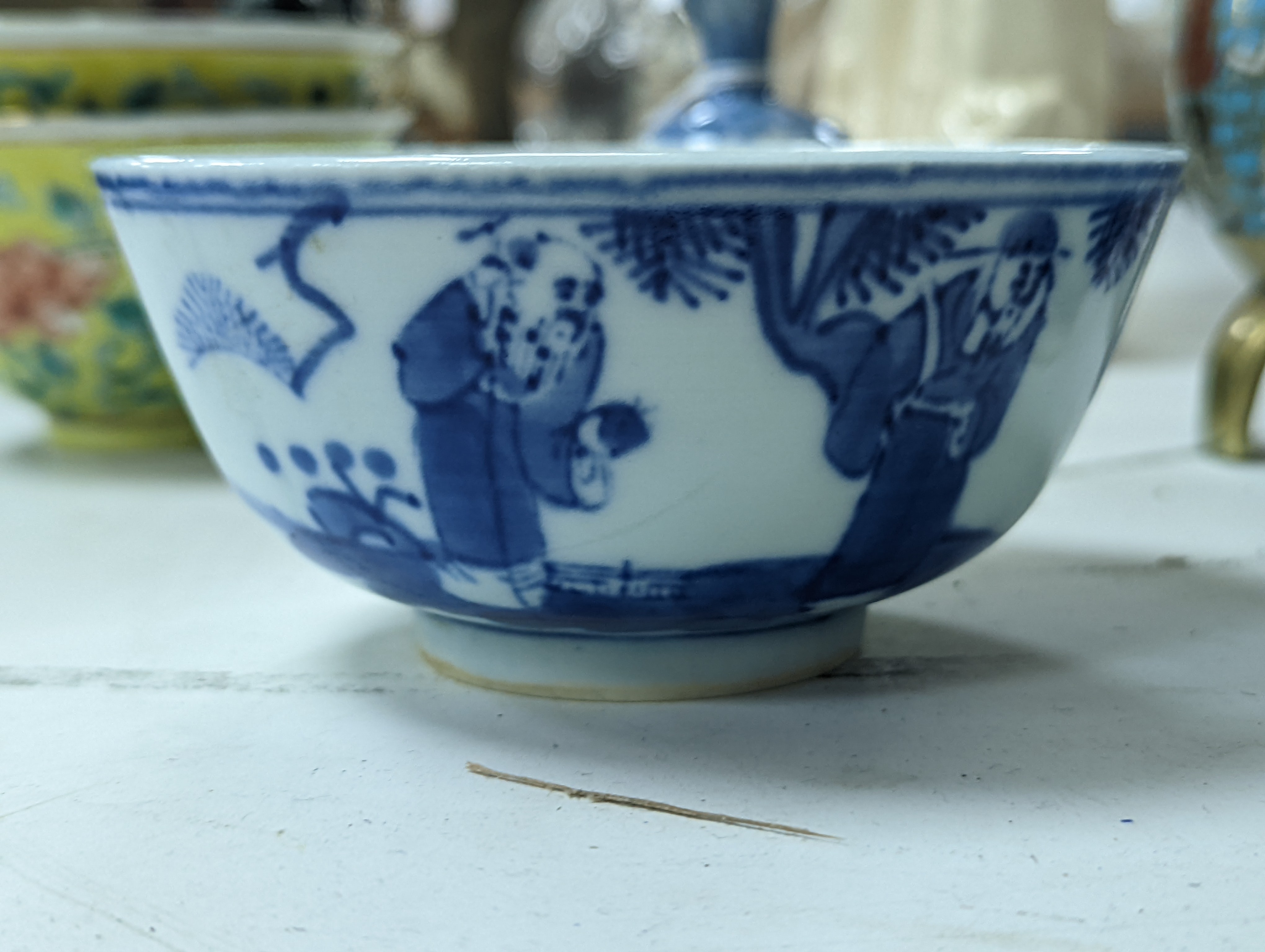 A group of Chinese porcelain, 19th /20th century, to include a pair of yellow ground bowls, 10.8 cm diameter, a blue and white vase, Xuande mark, a similar bowl and vase, and a champleve enamel bronze koro and cover